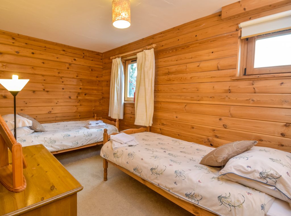 Self Catering Holiday Accommodation - Downstairs room with wardrobe, dressing table and stool.